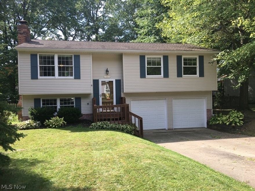 Very well maintained raised ranch in desirable area of Munroe Falls close to shopping, schools, restaurants, parks and library.  This seller has lovingly cared for their home but have outgrown it.  Home has been freshly painted inside and  power washed and painted deck and front porch.  There are new garage doors and openers. In 2017 there was a new furnace and air conditioning.  Their children love the back yard.  It is totally fenced in and lots of room for pool, swing sets and more.
