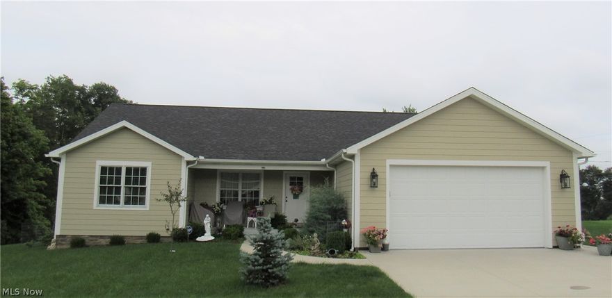 This Home Sweet Home is a Custom Built Ranch with 3 Bedrooms, 2 Full Bathrooms, Open Concept Family Room, Eat-in Kitchen, and Dinette that's 3 years young and waiting on a new owner. This beautifully decorated home has so much to offer with an Open Concept, Spacious Rooms, Hardwood Floors, and Split Bedrooms. So come on in for your personal tour! As you approach the inviting front porch enter into your Foyer area with a Guest Closet. In the Open Area, you will find your cozy Family Room, delightful Kitchen, and spacious Dinette. Enjoy all of the natural lighting, overhead lighting, warm oak hardwood flooring, and White woodwork throughout the house with touches of Oak. To the left, you will find a hall that connects your two large Bedrooms each with double and single closets with the main bathroom in between. On the opposite side of the home, you in find your very spacious Owner's Suite with a sitting area, Walk-in closet, and Bathroom! You'll never want to leave this area. From the Ow