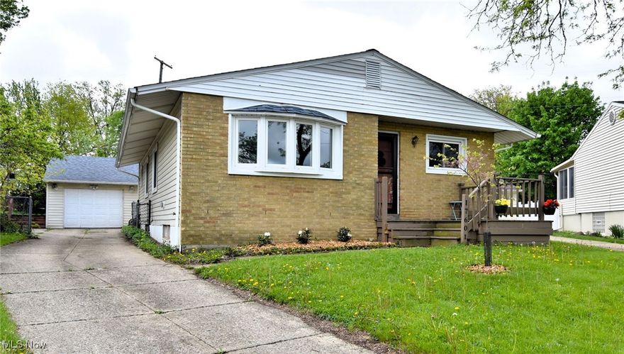 Welcome to this beautifully updated brick and vinyl ranch, nestled on a peaceful cul-de-sac in the desirable community of Westpark! Perched on a gentle hill, this home makes a charming first impression with its inviting front deck porch and driveway featuring a parking pad for a second car. Inside find 3 comfortable bedrooms, a updated full bath, and a convenient and updated half bath. The welcoming foyer includes a coat closet. Plus a rear mudroom/drop zone, with luxury vinyl plank flooring and an updated powder room featuring a quartzite countertop adds both function and style. The spacious living room is highlighted by a large bay window with a wide sill, perfect for displaying your favorite houseplants! Enjoy peace of mind with all HVAC and windows replaced in 2017! And roof 2018! Carpet runs through the living room and hallway, while the eat-in kitchen boasts stainless steel appliances, updated white Shaker-style cabinets, a ceiling fan, and a pantry. Both bathrooms were stylishly renovated in 2021, featuring a quartzite shower surround.  The finished lower level offers a generous recreation space, while the unfinished utility side provides ample room for laundry and storage. Washer/Dryer set stays. LVP flooring continues down the stairs for a seamless look. Out back, enjoy a fully fenced yard with a private feel, plus a spacious deck, ideal for relaxing or entertaining. The roof was replaced in 2018, and gutter guards were added to both the home and garage in 2024. The garage is fully equipped with electric, an opener, and a large bonus room on the side for added flexibility. Be sure to check out the video tour and schedule your private showing today, this gem won't last long!