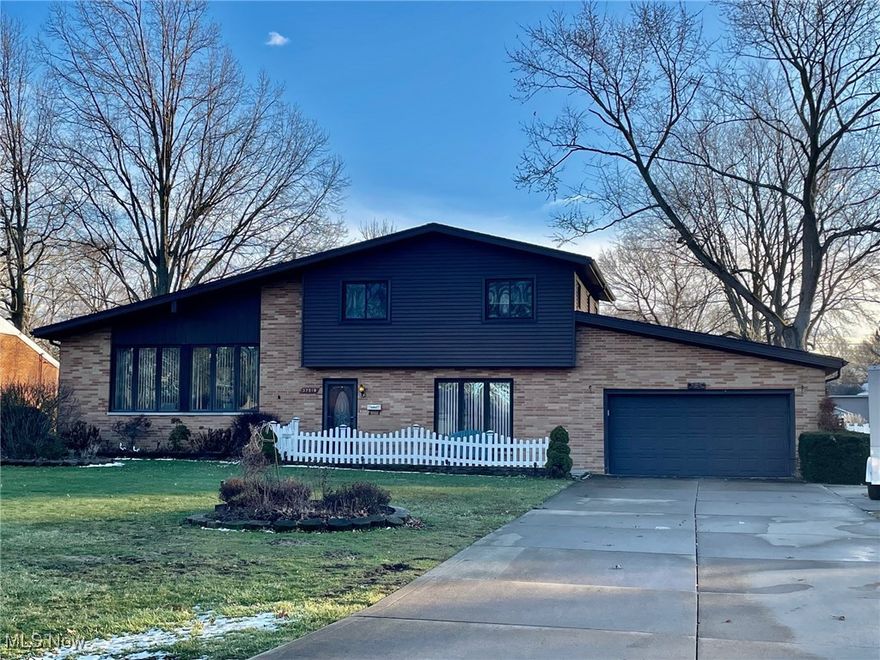 Immaculate Brick 4-Level Split in desirable South Willoughby neighborhood!  Upon entering this home, you will appreciate its spaciousness with vaulted ceilings, exposed beams and tons of natural light making it a bright and airy living space. The main level offers a huge Family Room w/laminate flooring, garage access and storage closet.  There is a Full updated Bath on this level as well. Head up a few stairs to the second level featuring an open layout connecting the Living Room and Kitchen. The spacious Kitchen has 
Oak "cabinets galore" including a built-in buffet in the dining area, breakfast bar, all appliances, a beautiful tile backsplash, instant hot water feature, and sliding door w/access to the deck/backyard. On the third level you will find the Main Bedroom w/double closets, 2 additional Bedrooms and a Full Bath. The finished lower level offers an additional bedroom option, half bath, laundry w/stand up shower, crawl space w/tons of storage and glass block windows. There is an additional 1.5 car garage addition w/heat adding to the 2 car attached garage w/Nature Stone flooring.  Outside is an entertainer's dream offering a huge 2-tier deck w/covered portion that has skylights and a built in gas grill. Additional features of this home include Pella windows, ice dam prevention cables, a full house exhaust fan, storage shed & several drains and cleanouts around the yard for easy access. This home has been lovingly maintained and well cared for over the years...schedule your showing today!!!