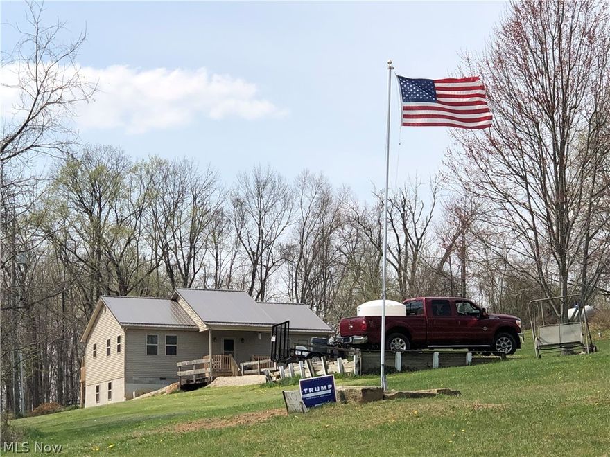 Newly built custom 2 bed, 1 1/2, RANCH WITH OVER 4.5ACRES.  Additional land also available.  Easy access from SR 78.  5 min from town.  The home is easily takes care of itself with a metal roof, vinyl siding, continuous gutters with leaf guards and everything new in 2019.  The spacious eat-in kitchen is custom Amish made hickory cabinets, counters and appliances stay.  200 amp electric box with generator hookup installed.  Mature walnut and fruit trees.  The walkout basement is ready to be made into a finished basement.  Camper/RV parking with septic hookup bonus.  Constructed solid with 2x6 walls and 2x12 floor joists, double insulation with the highest electric Bill of $63. To date.  Propane furnace with 500 gallon tank.  A line to hook into natural gas could be installed (currently NOT) outbuilding/shed 12’x20 with lean to for lawn tractor parking. Special features of 36” doors, laundry on first floor with single level living and ramp access in the back.  Wildlife galore!