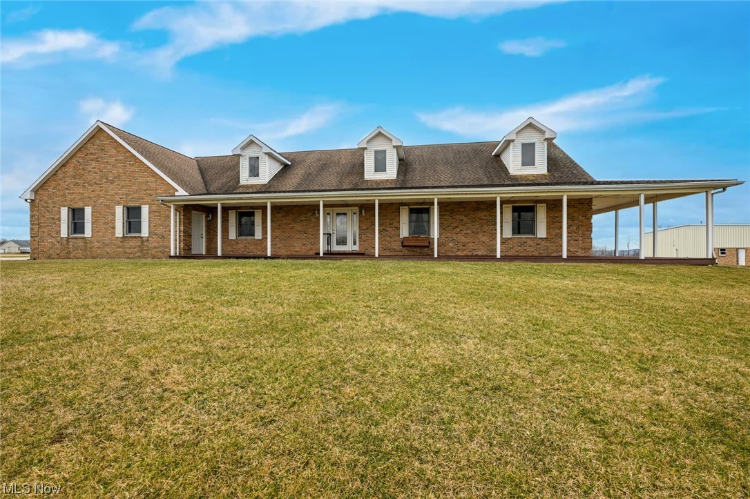 Welcome home to your amazing country estate with custom built 3260sf brick home with 4 bedrooms and 3.5 bathrooms! So many extras within this property! Private setting! Free Gas! The wrap around composite covered porch is perfect for enjoying the stunning sunsets here at "Top of the World!" Heated flooring in the 2.5 plus attached garage (with nature stone and access to the basement). The kitchen, laundry room, master bathroom and basement all have heated flooring too! Whole house audio system (all equipment will remain)! Gas fireplace! Back up generator! Open floor concept. First floor owner's suite with 12x7 walk in closet and french door lead you to the back part of the covered porch! 60x92 heated steel outbuilding (with 2 sinks and bathroom and 200amp electric service) is perfect for the business owner, collector, mechanic or hobbyist! Tons of parking and plenty of storage! Full unfinished basement with full bathroom too. What are you waiting for? This is a true gem for car enthusiasts or anyone seeking a serene retreat. Schedule your showing today!