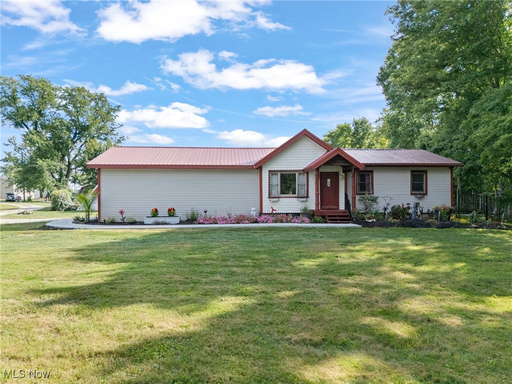 Discover this exceptional three-bedroom residence situated on a spacious lot outside City limits. Formerly a deer farm, this unique property offers a rare blend of open space and modern amenities. The backyard is a true resort, centered around a spectacular 18x38-foot swimming pool. This incredible feature includes an 8.5-foot deep end, a custom slide, and is secured by an eight-foot fence for privacy and safety. For year-round relaxation, retreat to the dedicated indoor hot tub room. Inside, the spacious basement is clean, dry, and ready for finishing, offering a perfect blank canvas to create the media room, gym, or recreation area of your dreams. Practical upgrades include a newly poured garage floor, walkway, and garage door openers. Other upgrades less than 10 years are the roof, HVAC, & windows. A substantial 16x26 outbuilding, complete with a durable 2-inch tongue-and-groove floor, offers versatile space for a workshop or extensive storage. This property is a must-see for those seeking space, privacy, and unparalleled amenities. Schedule your private tour today.