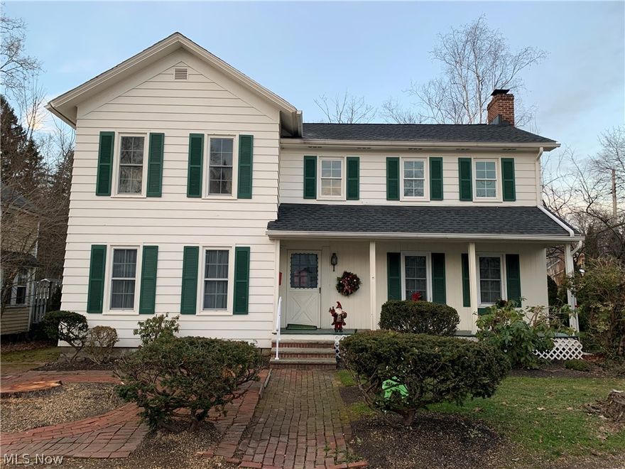 Character and charm in Chagrin Falls!  That's what you'll find in this wonderful front porch center hall colonial in the heart of the Village from the shining hardwood floors to the covered front porch or the brick patio and walkways.    Spacious LR and formal DR flank the front center hall upon entry.  Eat-in kitchen with s/s appliances boasts plenty of cabinet space, newer counters and new LVT flooring (2020).  Full bath on both first and second floors both with recent updates.  Three BRs on 2nd floor with additional bonus room that can be a small 4th BR or office.  Adorable yard that is nicely sized for this price point in the Village with both covered and uncovered patio. Several other improvements include AC 2015, furnace 2016, hot water tank 2014, roof 2016, and much more!!   December 2020 updates include several new light fixtures, new vanity in first floor bathroom and new accent tile around the second floor shower. After two and a half decades this home is ready for a new owne