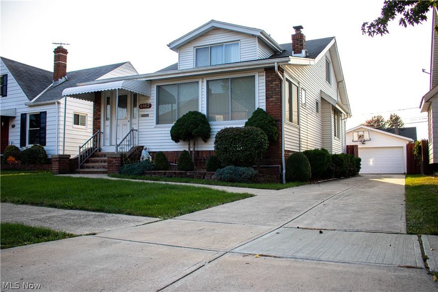 This 1.5 story Cape Cod home in Parma, Ohio features a beautiful foyer, that brings in plenty of daylight, and includes beautiful white brick. Upon entry into the main space, you will find a spacious living room with an adjacent sun room, allowing plenty of natural daylight in the space. The home features beautiful millwork and trim throughout, and has a unique charm that makes the space instantly feel like home. Moving further into the home, the dining room includes a beautiful window seat, leading into the kitchen, which contains all stainless steel appliances. The first floor features 2 bedrooms, and 1 full bath. The light and airy feeling of the home is certainly conducive to many different style preferences. Moving to the second floor, the home contains 2 bedrooms, with custom cabinetry for plenty of storage. The finished basement contains a full bathroom, equipped with a jetted tub, and a tv as well. The outdoor space is perfect for entertaining, with a fenced-in yard, and full b