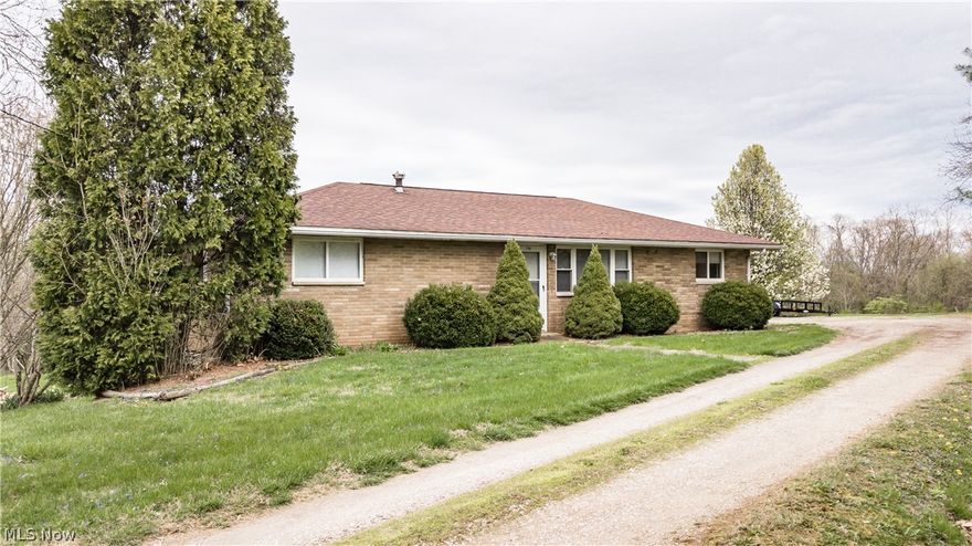 2 bed 2 bath ranch style home sitting semi-privately on a nice flat 2.5-acre lot with a horse stable.  The home was originally a 3 bedroom and could be converted back by adding a wall.  Partially finished basement with carpeted rec room.  Also in basement is an older concrete shower (great spot for bathing dogs).  Warren Local School District!!  Motivated Seller!! Sold as is.