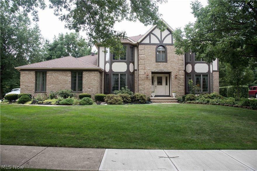 This four bedroom, four bath colonial is located near Strongsville High School and the many shops and restaurants of Strongsville. A beautiful yard that is filled with perennials for year-round color and a captivating rose garden will be a delight for the new homeowners. The yard is enhanced with a sprinkler system, shed, deck and an additional parking pad for 2 vehicles. An attached two car garage with hot and cold water, drain, electricity and an outlet for the central vac will make cleaning your cars a breeze! This home has everything you are looking for! With a second, full kitchen and full bath in the finished lower level - there are many living options. The whole house sound system provides music enjoyment in every room. A spacious kitchen that opens to the family room with custom cabinetry and a wood-burning fireplace is the heart of the home. A generously sized dining room and living room provide the space needed for gatherings. A first floor office will make working from home