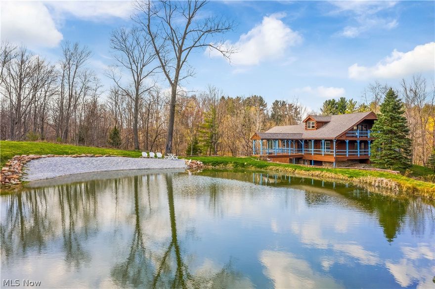 Rustic yet modern, this private lake house property makes you feel like you are on vacation year-round! Situated on 4.33 scenic acres, 3860 Briarwood in Richfield features a ravine and creek that lead to a .4 acre stocked pond (Bluegills & Trout) with a limestone beach, newly cleared/landscaped yard, 1 acre setup for deer food plots and a treehouse! The 2-story, 2,800 sq. ft. home is perfect for entertaining and takes your breath away the moment you step inside. The 1st level has an open floor plan with remodeled kitchen, new appliances, and bridge walkway to the pond. The great room features a stunning floor-to-ceiling stone fireplace, and wood floors, walls, and ceilings. On the 1st floor you’ll also find office space and a spacious sunroom featuring a Mail Pouch wall mural, wood beams & open loft space. 2 spacious 1st floor bedrooms share a remodeled full bath & have access to wrap around deck. The 2nd floor master suite has a remodeled bathroom and private deck overlooking the lake