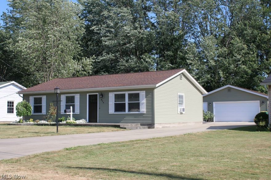 Turn Key home. This 3 bedroom home offers large living room, Newly updated eat in Kitchen with hickory cabinets, Corian counter tops, and stainless steal appliances. Freshly painted and new carpet throughout, new cabinets in utility room an much more. Stamped concrete porch and patio along with concrete driveway that leads to a private back yard retreat. There is a 4 car outbuilding with concrete floors, 220 throughout, bath and tons of space for the car person, or hobbyist Newer vinyl siding, newer bath, too much too list. This is a must see