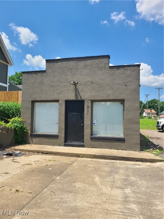 Business owners take a look 1200 sq ft brick building featuring new roof on high traffic road 2 baths an a additional rear lot for close to a quarter acre corner lot interior needs built out but a great blank slate for vape shop pizza shop salon endless opportunites