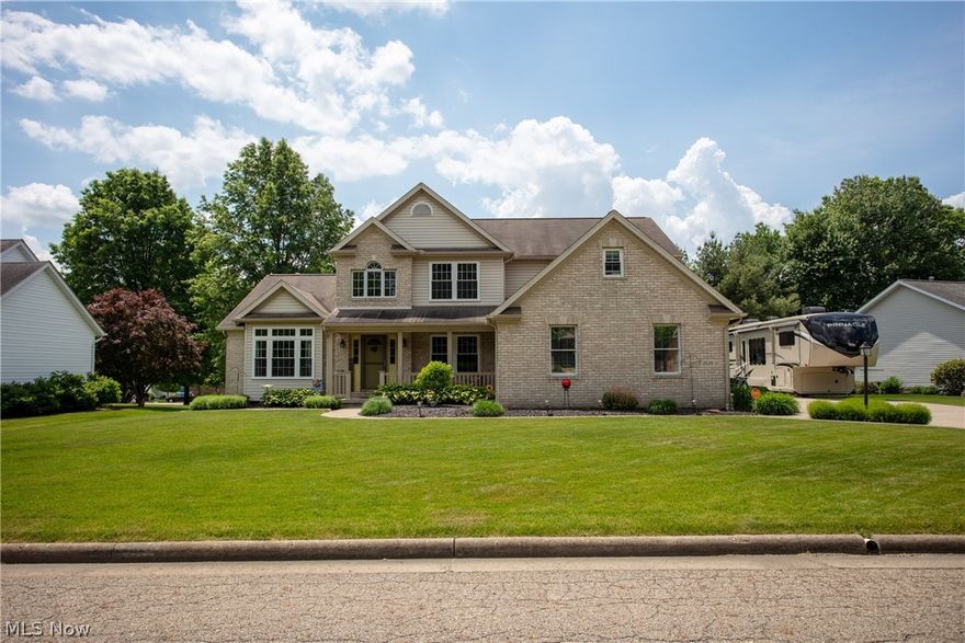 Beautifully updated colonial in Perry Local Schools! Walk in through the front door and admire the 2-story foyer w/ traditional staircase. Two-story Great Room w/ a wall of windows that gleams w/ natural light. Gas burning fireplace is perfect to cozy up to during the cooler months. Remodeled kitchen is absolutely gorgeous w/ granite countertops, Stainless Steel appliances & large pantry closet. Cabinets have pull-out shelves. Master bedroom on first floor is nice and bright w/ picture window. Ensuite has a large soaking tub, shower and walk-in closet. Front living room, laundry room and half bathroom complete the first floor. Heading upstairs, you'll walk down the catwalk balcony to come to the 2nd floor master bedroom w/ ensuite and large walk-in closet. 3rd bedroom w/ walk-in closet and attached bonus room (located above the garage). Upstairs hall bathroom and 4th bedroom complete this floor. Finished basement w/ living room, wet bar/kitchen area, rec room and half bathroom. This sp