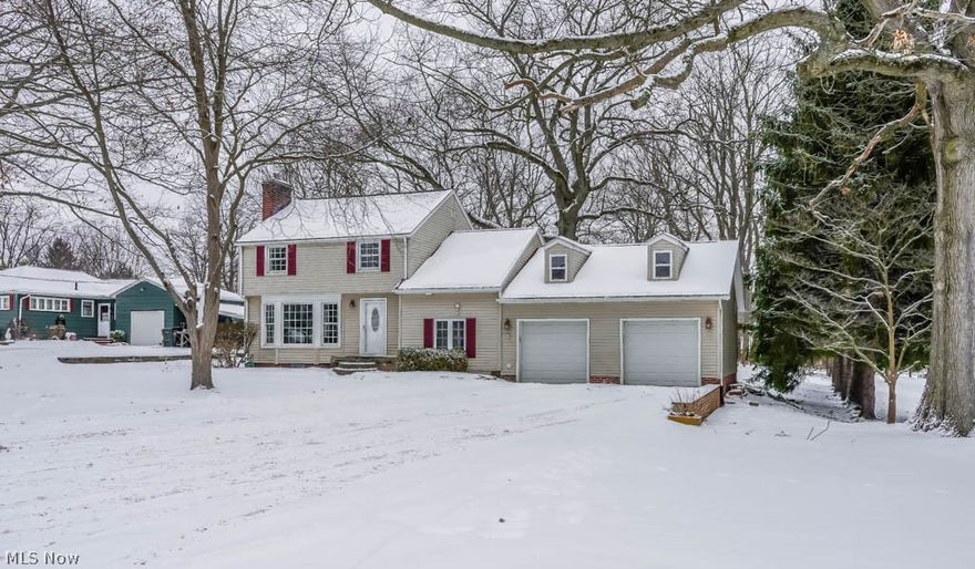 Gorgeous 3 bedroom, 2 full bath home situated on a large, wooded lot on .79 acres in Plain! Step inside the sun-filled living room boasting enormous windows, built-in shelving and a woodburning fireplace. Stunning, refinished hardwood floors grace the living room, dining room and bedrooms! Off of the formal dining room, there’s an enclosed porch with tile flooring and access to the large back deck overlooking acreage! Crack open your cookbook in the fully applianced, neutral kitchen with tile flooring, a lazy Susan and a pantry. Upstairs, there are 3 bedrooms with hardwood floors and a large full bath with tile flooring, tile shower surround and a linen closet. Hallway built-in plus an additional closet. The master bedroom is quite large and offers a walk-in closet with attic access. Bedroom 3 is on a half level - great for a recreational space or an office. On your way to the garage, there’s a first floor laundry room with a sink as well as a full bath with a walk-in shower! Access to