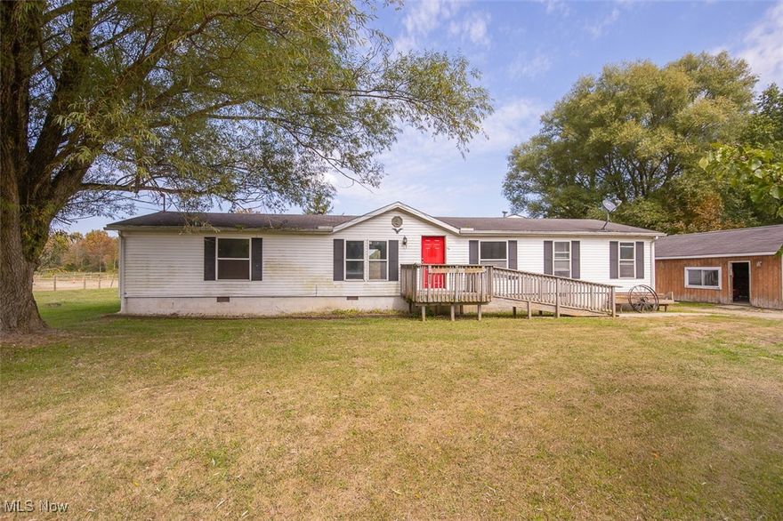 Come re-image this extremely large ranch style home. Let your chickens be free range and animals roam the over 3.50 acres.  Store your equipment and vehicles in this over sized barn/garage.  Enjoy coffe on the back overlooking the pond.  This quiet serene property is calling you.