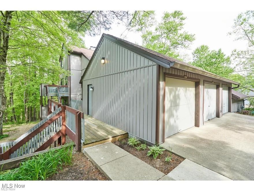 Only five steps into this secluded and private 1 bedroom, 1 bath condo with beautiful wooded views! Spacious eat-in kitchen with breakfast bar, gas range & dishwasher. Large living room w/ woodburning stone fireplace and slider to deck, plus full size laundry. Has a master bedroom with 2 closets, full bath, a wrap around deck to enjoy the outdoors, 1-car garage with attic and storage. This unit has Cuyahoga Falls electricity. Close to Portage Crossings shopping, dining & Cuyahoga Valley National Park. Only a 10 min drive to downtown Akron!