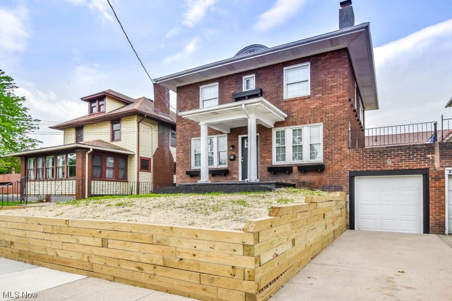 This stately brick colonial is sure to please with over 1600 sqft of living space and impressive updates throughout. Step inside through the new front door to the living room featuring a wood burning fireplace, built-in bookshelves, and multiple windows that fill the room with natural light. Luxury vinyl plank flooring continues into the spacious dining room accented by wainscot paneled walls and crown molding. Be the 1st to prepare meals in the brand new kitchen complete with a farmhouse sink, tile backsplash, stainless steel appliances, and a pantry. Head upstairs where you'll find 3 nicely sized bedrooms with new carpet and a refreshed full bath with a tub/shower with tile surround. A convenient 2nd full bath with a step in shower is available in the basement laundry room. This level also walks out to the attached single car garage.  Outside adds a patio and a partially fenced private backyard that's perfect for relaxing and entertaining. Notable improvements include a new furnace,
