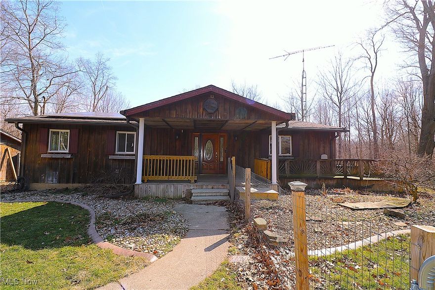 Recently updated ranch overlooking a ravine with creek on this 4 acre wooded paradise in Edison School District! Sitting over 450 feet off the road, this 3 bedroom home includes a partially finished walkout lower level with a rec room, family room/4th bedroom and full bathroom. Natural gas service to this home. HVAC and gas fireplace were new in 2024. The updated kitchen boasts granite countertops, newer appliances, a spacious island, and partial wall that allows views into the living room and of the wildlife that fills the wooded ravine behind this home. Other features include a 3-car detached garage that is heated with gas furnace and with lean-to, large front porch with access to fenced dog run. Spiral staircase to lower level. Solar panels in place to reduce electric bill. Subject to survey and lot split approval prior to closing. New stone drive way will be completed prior to closing. Buyer must hook up to rural water within one year of closing.