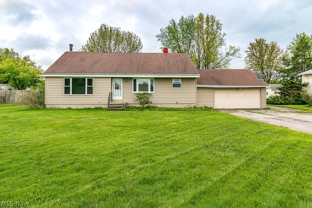 Are you on the hunt for an affordable home in one of Cleveland's premier east side suburbs and school districts? Look no further than this spacious split level that sits on an oversized lot at the end of a dead end street. A rare opportunity to live near all the great amenities Mentor has to offer without the hustle of a busy street. Step inside to the recently updated eat-in kitchen complete with an abundance of cabinet space and a bay window. Gather in the adjacent living room or relax around the wood burning fireplace with stone surround in the lower level family room. The sunroom extends your entertaining space overlooking the expansive backyard, where there's untapped potential to add a patio, fire pit or even a pool! A half bath and laundry room are conveniently located nearby. Upstairs you'll find all three nicely sized bedrooms along with a full bath with a tub/shower combo. With a bit of tender loving care, this could be your dream home! Schedule your showing before it's gone!