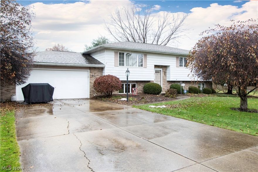 Well kept 3 bed 2 bath move-in ready bi-level home on an oversized corner lot in great Newton Falls neighborhood. The main floor of the home features fresh paint and carpet throughout. Spacious living room, formal dining room with sliding glass doors to the deck, updated kitchen with breakfast bar - all appliances stay. This level has 3 bedrooms and a full bath. The lower level has a large family room with wood burner and a full bath. There's also a large unfinished storage room and a laundry/utility room that walks out to the attached 2 car garage with pull down attic storage. The house also has a second garage 24x24 detached 2 car with lofted overhead storage. Home Warranty included. Call Today!