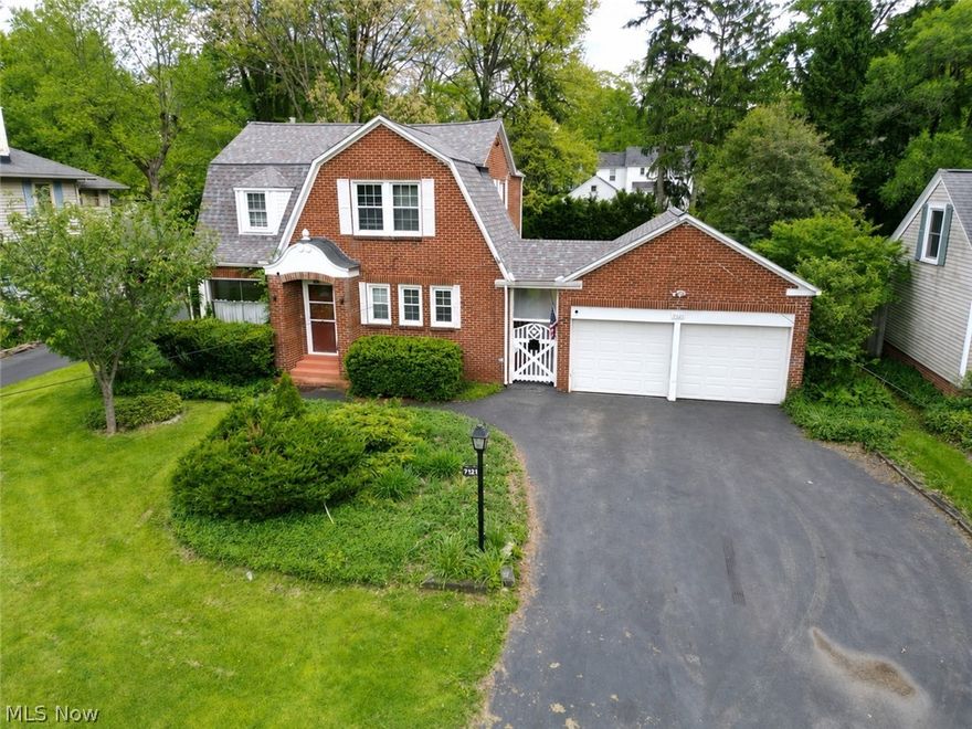 Welcome to this all brick, 3-bedroom home with tons of character in the Poland Local School District! Outside you'll notice the charm of this house but with a newer roof, siding, and downspouts as well as almost all updated windows (2017)! With over 1800 sq. ft., this home welcomes you into a living room with brick herringbone woodburning fireplace, real hardwood floors and a cute little room off this living space which would be good for an office, reading nook, or play area! The dining room has a new chandelier as well as hardwood floors and windows looking out to the private backyard! This leads into a huge family room with access to the outdoor patio! The kitchen comes with a fridge, dishwasher (2025), granite countertops and a cute eat-in area with tons of little storage cabinets! A half bath is just around the corner on the main level too! Upstairs has 3-bedrooms... one is a large bedroom with 2 closets; another has 3 closets and all with hardwood flooring! A full bathroom with tub/shower combo serves this level as well! The basement has a walk-out to the backyard, many different storage rooms and a laundry area with washer/dryer that stays! Outside is the 2-car garage which you can access through the covered breezeway that also leads into a huge storage area off the back of the garage. You heard it again- TONS of storage, great location, and lots of charm! Other updates include A/C 2025, chimney rebuild and flex-liner installed (2021), HWT 2022, and newer garage doors!