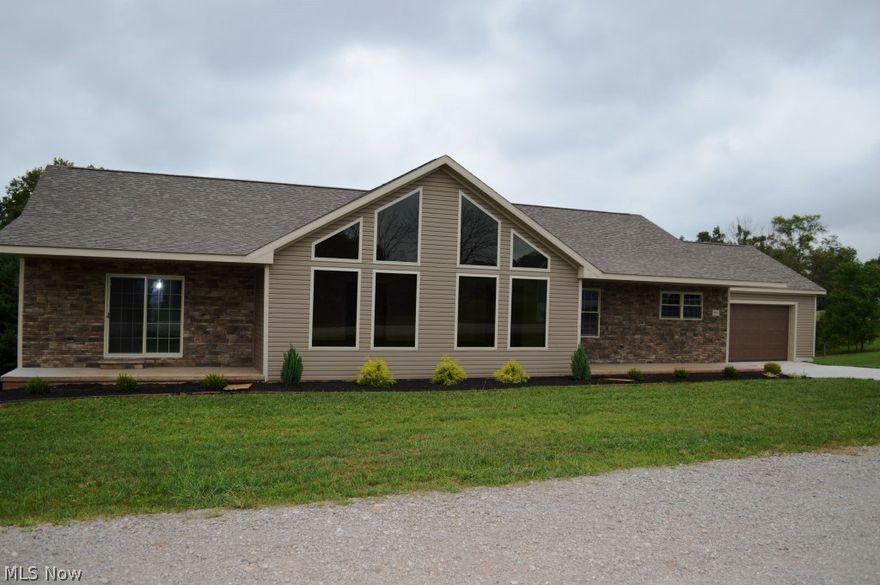 Brand New, Quality Construction! You enter into a beautiful family room, with cathedral ceiling, wall of windows (blackout tinted for heat), stone gas vent free fireplace with blower with decorative light above and custom wood mantle, family room open to every cooks dream kitchen. Kitchen offers an abundance of custom poplar cabinets with porcelain countertops, stainless steel appliances with double oven, cultured granite sink, with oversized island and an additional 8'x9' pantry or office area. Master suite offers enough area for a sitting space, wall sconces and offers sliding door to its very own porch, master bath offers a 7'x7' custom walk-in tile shower, 6'x14' walk-in closet, double bowl sink with marble vanity. 12'x20' back deck, 2800 sq. ft., full walk-out basement to patio and back yard,  basement offers 10' ceilings and easily could be finished with additional bathrooms, more bedrooms or great room, 24'x26' garage with 8' high by 18' garage door. Interior is complete, centra