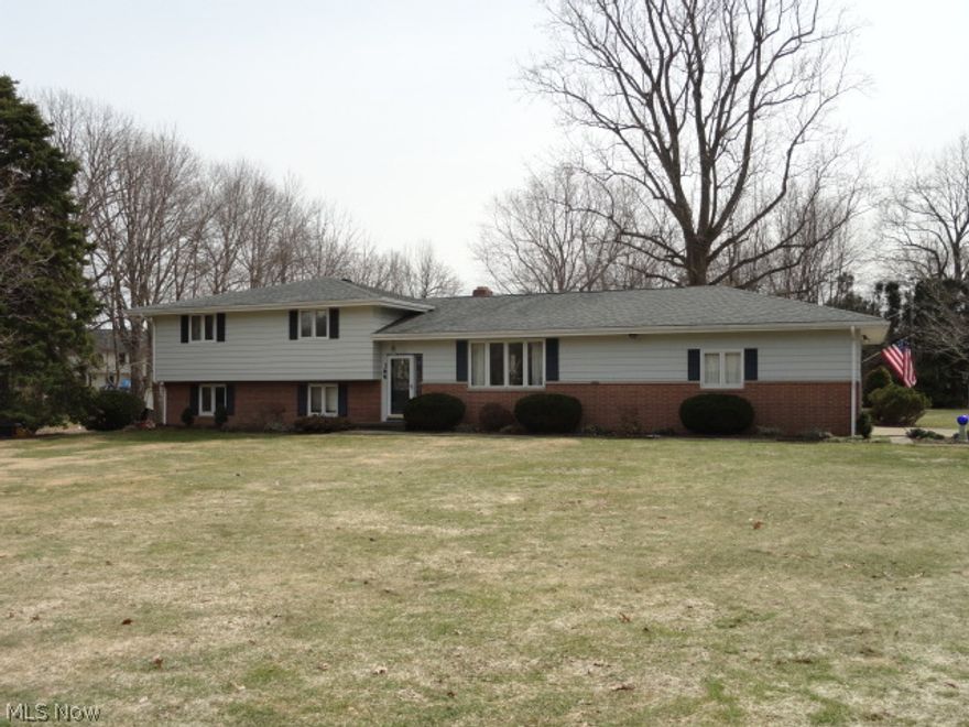 Beautiful 1 acre lot adjacent to Bob-O-Link with an immaculately maintained, over sized 4 level split with dramatic vaulted ceilings in living room and dining room, spacious eat-in kitchen, 4 large bedrooms and 2 baths on upper level and a light, bright and cozy family room with fireplace and walk-out to the tranquil patio area with pond.  Updates include Air Conditioning 2012, Kitchen Counters/Back Splash 2012, Bathroom tile & toilet 2012, Paint & carpeting 2012, Roof 2011, Glass Block Windows 2004, Windows 2002,  Storage Barn 2000 and the garage is a very large & actually big enough for 3 cars.  So many wonderful features and a rare find!