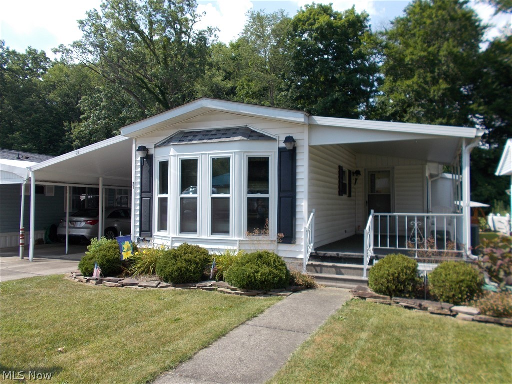Looking for a summer home or a place to retire? Here it is! The Willows, an over 55 community, nestled in between Ellet and Mogadore. A country feeling yet close to all the necessary conveniences and highways. This 2 bedroom home has been meticulously maintained and is move in ready! Professionally cleaned and all carpets fresh and clean! Large living area opens to the "U" shaped kitchen with all appliances included, Oak cabinetry. pantry and plenty of storage. The dining area features a bay window and more built in oak cabinets with glass faced doors. The master bedroom has double closets, vanity and walks into the spacious bath w/soaking tub. step in shower and double sink vanity. The laundry is just steps away complete with washer and dryer. The 2nd bedroom with double closet is perfect for guests, den/office. crafts or whatever other needs you may have. You will love the 3 season sunroom with windows around, newer carpet and another large closet for your off season clothes
