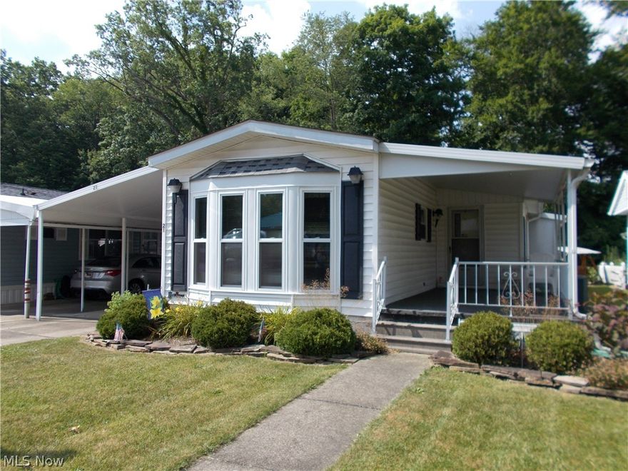 Looking for a summer home or a place to retire? Here it is! The Willows, an over 55 community, nestled in between Ellet and Mogadore.  A country feeling yet close to all the necessary conveniences and highways.  This  2 bedroom home has been meticulously maintained and is move in ready!  Professionally cleaned and all carpets fresh and clean! Large living area opens  to the "U" shaped kitchen with all appliances included, Oak cabinetry. pantry and plenty of storage. The dining area features a bay window and more built in oak cabinets with glass faced doors.   The master bedroom has double closets, vanity and walks into the spacious bath w/soaking tub. step in shower and double sink vanity. The laundry is just steps away complete with washer and dryer. The 2nd bedroom with double closet is perfect for guests, den/office. crafts or whatever other needs you may  have.  You will love the 3 season sunroom with windows around, newer carpet and another large closet for your off season clothes