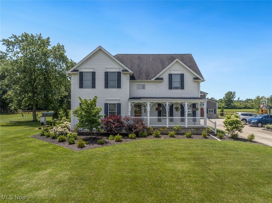 This exceptional custom-built home, completed in 2001, offers 2,664 square feet of living space and a 1,440 square feet upscale barn designed for outdoor living, making it a truly unique property. The main house features an open-concept design, including a welcoming front porch and a spacious kitchen with custom cabinets and Corian countertops. The main first floor has hard floors throughout, adding to the home's elegant and cohesive feel. The cozy family room includes a gas fireplace with a unique 1920s-era mantel, perfect for relaxing evenings. Elongated windows and high ceilings fill the space with natural light, complemented by custom blinds throughout. The home includes three bedrooms, and a generously sized master suite offering ample closet space and a private bathroom. Additionally, the newly finished room in the year 2020 in the basement features a significantly large closet, providing flexibility for a home office, gym, or extra living space. Set on nearly an acre, the property showcases a modern 1,440 square feet barn, an award-winning structure previously named "Barn of the Year." This heated barn is a modern gem that includes a loft, a huge gathering area, and doors that open on three sides, making it ideal for entertaining, a home business, or a creative studio. Additional perks include cement board siding, 75 gallon hot water tank, and hot tub hook up ready with newer electrical panel (2019). The beautifully landscaped backyard features angular designs that shadow the peaks of the roof, creating a dynamic visual effect. It's the perfect spot to relax and enjoy unbelievable sunsets over the open fields behind the property. This home blends charm, versatility, and thoughtful design. Schedule your private showing today!