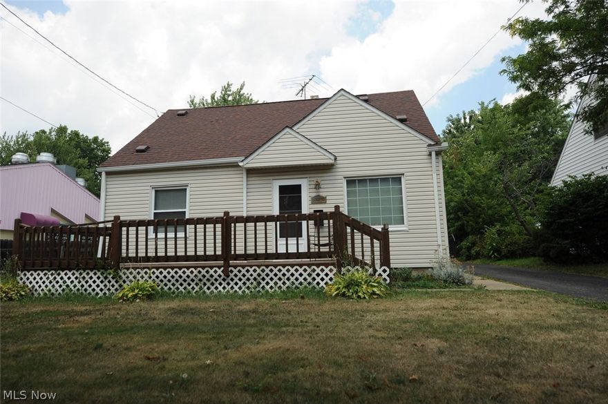 Your new Akron home is here! This nice sized cape is move in ready.  Large, open kitchen and dining area has sliding glass doors that open up to the incredible back yard.  Entirely fenced in yard is perfect for kids, pets, a garden and a pool.  The fence also divides the yard into 2 areas, great for keeping the kids or pets close.  Living room, hall and second floor have beautiful hardwood floors.  Two bedrooms and bath on main level.  Large, full basement with newer furnace, hot water tank and washer/dryer.  Updated electrical and windows, newer siding, paved drive, 1 car garage and giant front deck.  Home is conveniently located just minutes from rt 8.  Call for your showing today!  This great home won't last!