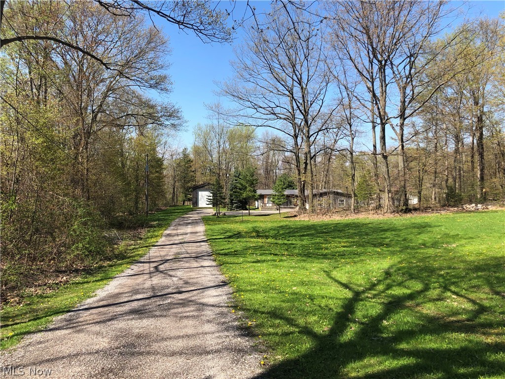Beautiful 3.87 acres in a country setting, south of Conneaut Ohio. Ranch Style with 3 bedrooms, master bath, all open concept livingarea, kitchen with wood burning stove. It has a 2.5 car garage attached with wood burner, plus a detached 20x40 garage and a barn with stalls. All on a peaceful country road. Home has a osmosis water system, metal roof and newer septic system. A must see!