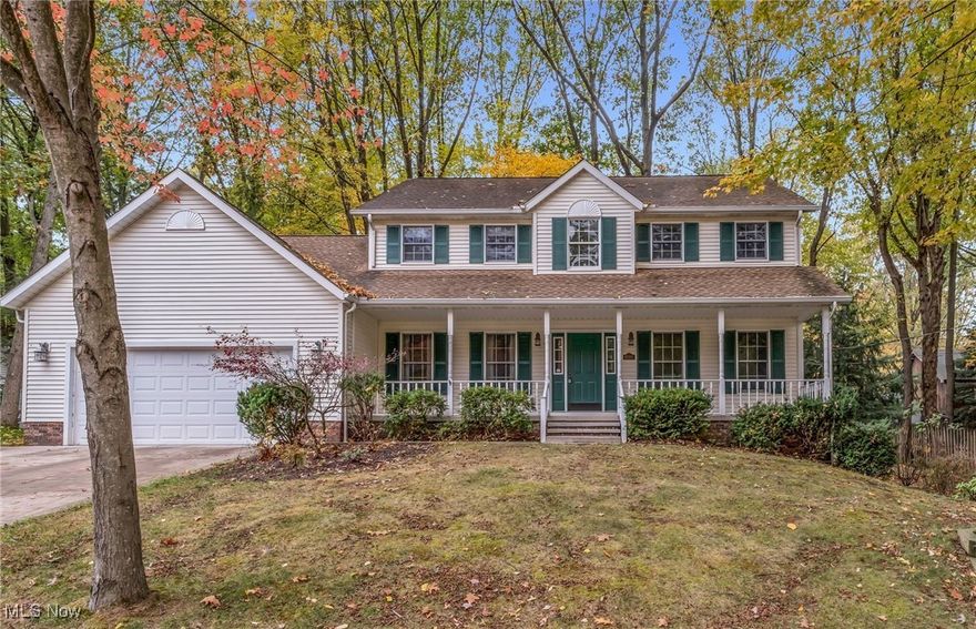 This incredible home boasts 4 bedrooms / 4 baths , finished walkout lower level, private yard and desirable cul-de-sac location! Main floor features a large foyer entry with new flooring, center hall staircase, formal dining room and living room with gorgeous hardwood floors. The spacious eat-in kitchen comes with all appliances and is finished with new flooring, breakfast bar and granite counters! Kitchen opens up to the comfortable family room highlighted by a raised hearth fireplace, and sliding door with backyard access. Additionally, on the main level there is a half bath, laundry room with washer & dryer and an office w/a closet that could double as a 5th bedroom! Upstairs you will find the generous sized owner's suite and ensuite w/ granite vanity, whirlpool tub and walk-in shower. The second floor also offers three additional bedrooms and a main bath. Lower-level walks out to a side patio and second driveway!  It's been thoughtfully finished to include a recreation room, Bar/beverage station and second family room! Enjoy the outdoors while relaxing on the covered front porch or while entertaining on the large screened in porch overlooking the wooded backyard. Notable improvements include Updated appliances, HVAC (2022), Roof (2013), Both Driveways (2019), Hardwood Floors (2021), Carpet (2021), Garage opener (2022). Conveniently located to the Kent State University campus, downtown Kent, restaurants, shopping and the bike & hike trail.