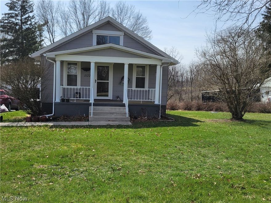 Adorable, well maintained 3 bdrm, 1 bath with beautiful woodwork and mostly hardwood floors throughout. Galley kitchen with laundry area and room to add additional cabinetry/counters.  There is also a laundry hookup in basement to allow for more room in the kitchen.  Dining room has built in cabinets and hardwood floors.  3 bdrms with nice closets and full bath finish this home that is move in ready.  There is a large front porch and small side deck.  1 car detached garage with remote opener, paved driveway and nice, private back yard. Lots of updates in this home, fuel oil furnace, water heater, 200 amp electric, roof, windows newer within 5 years. Garage is approximately 15 years old.  County sewer expense is approx. $55/mo. Call today for your showing.