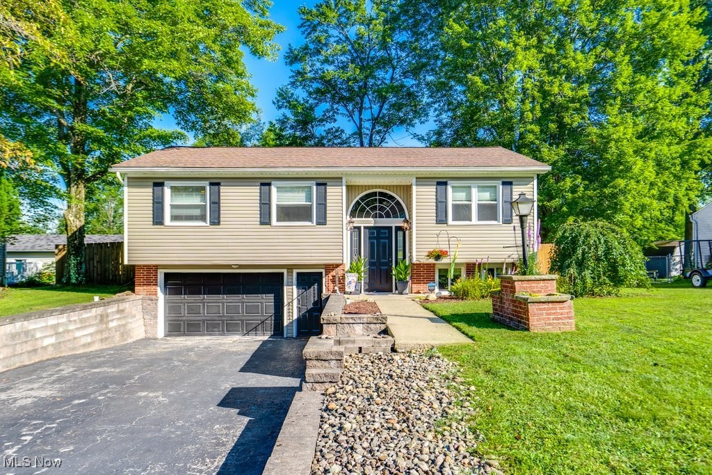 Welcome home to this inviting 3-bedroom, 2-bathroom bi-level nestled in a quiet neighborhood. Step inside to discover a bright layout, featuring an updated kitchen with modern appliances, sleek countertops, and plenty of cabinet space — perfect for everyday living and entertaining. Upstairs, you'll find comfortable bedrooms and a full bath, while the lower level offers additional living space, a second full bathroom, and great flexibility for a home office, gym, or guest suite. Outside, enjoy the fully fenced-in backyard — beautifully maintained and ideal for pets, kids, or weekend gatherings. Whether you're relaxing on the patio or gardening in the sun, this backyard is a private oasis. With its thoughtful updates and functional layout, this home is move-in ready and waiting for you!
