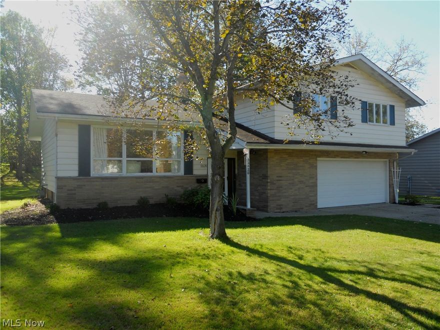 This one is for YOU!!!  4 Bedroom 2 and 1/2 split nestled in the beautiful Hunt Club of Solon.  This property has been totally redone from top (roof-5years) to bottom (new wood laminet in Family Room).  Kitchen is fresh and new and includes new cabinets and appliances and new corion counter tops and new wood laminet floors.  The four bedrooms all have hardwood floors and the Master has a full bath.  This split level does have a basement with a large finished work room and an unfinished storage room.  The beautiful lot has been meticulously maintained with a lovely brick patio in the back for your enjoyment on those wonderful autum nights.  Seeing is Believing!