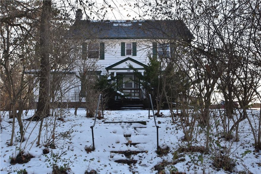 Bring your vision to this stately 4-bedroom, 2-bath colonial in Garfield Heights. Wood floors, built-in features, and attention to architectural detail invite you to explore. The home's entry is gracious and flows into a spacious living room with a beautiful fireplace and mantle. The adjacent sun room has windows on three walls, deocrative crown molding, and a built-in bookcase; once refurbished, this would be a wonderful space to relax with a cup of coffee. The dining room is highlighted by glass-fronted cabinets and ample built-in storage. The eat-in kitchen offers comfortable space. Continue to the second floor, where you will find four nice-sized bedrooms, a shared full bath, and an ensuite full bath. Convenient linen storage is available in the hall. The unfinished attic provides considerable storage, as well as the potential for other uses, along with a bookcase and cedar closet. The home's full, unfinished basement has glass block windows, a utility sink, and storage; sellers report that the furnace and hot water heater are functional. The enclosed back porch is unheated and would be a great space to enjoy warmer northeast Ohio evenings. Two-car detached garage with drain and electric. Take a look at the potential in this property today!