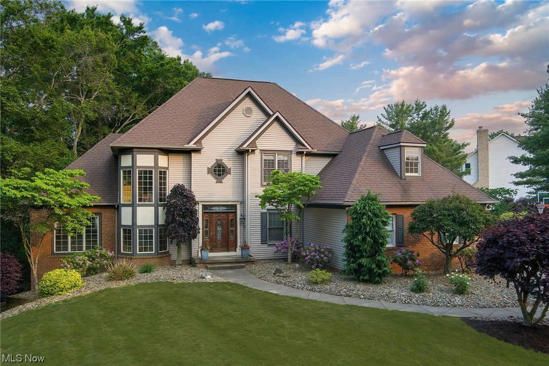 STOP! Don't miss this.This stunning residence offers a formal yet airy floorplan, ideal for comfortable living and entertaining. As you step inside, you'll be greeted by a high-end staircase overlooking the impressive two-story foyer, setting the stage for the elegance that awaits. The family room is a delightful space featuring a vaulted ceiling that enhances the sense of openness and floods the room with natural light. Adjacent to the family room is a formal living room, boasting built-in bookcases and a charming brick fireplace, perfect for cozy gatherings or quiet relaxation. Enjoy the picturesque views from the sunroom, which leads out to a spacious deck where you can enjoy the tranquility of the outdoors. The first-floor laundry room makes daily chores a breeze. The large kitchen is adorned with white cabinetry and a generous dinette area. The abundance of wood flooring throughout the first floor adds warmth and elegance to the space.
Retreat to the owner's suite, a true sanctu