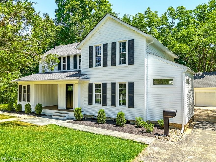 Welcome home to 6861 Brecksville Road, nestled in the coveted city of Independence. This exceptional opportunity invites you to own a slice of history. Once part of the esteemed Lowe Estate, this enchanting colonial, constructed in the late 1800s, has been meticulously transformed into a contemporary dream home. A charming covered porch beckons, offering the perfect spot for unwinding. Upon entry, the home's open concept design becomes apparent. The spacious foyer ushers you into the expansive great room, flanked by the kitchen and dining area. The stunning kitchen boasts ample cabinet and countertop space, enhanced by a chic backsplash, leathered granite countertops, and sleek stainless steel appliances. The front hallway guides you to the convenient first-floor laundry and guest bathroom. The main floor also presents a genuine master suite, complete with a wood-burning fireplace, an en-suite bathroom with a stand-up shower, and a capacious walk-in closet. The second floor accommodates three sizable bedrooms and two full bathrooms. A detached two-car garage complements the residence. Recent enhancements include new flooring, kitchen, paint, windows, light fixtures, appliances, gutters, garage door/opener and landscaping.  The roof is six years old, and the furnace and air conditioning were replaced in 2022.  Strategically situated with effortless access to major highways, shopping, dining, and downtown Cleveland, this home's location is unparalleled. Additionally, it offers close proximity to the Town Center, Elmwood Park, and the Civic Center. Contact us to arrange your exclusive private tour today, as this gem is sure to be in high demand.