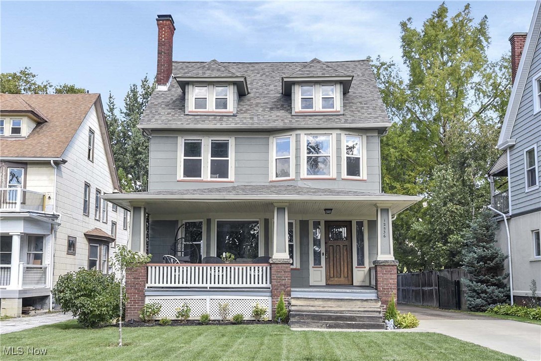 Prepare to be moved! Welcome to 12536 Clifton Boulevard, Lakewood, OH 44107—an exceptionally maintained 3-story colonial that boasts the timeless Lakewood charm with thoughtful modern updates. From the moment you enter the inviting foyer, you're met with unique architectural touches, from the antique front door hardware to the intricate lead glass windows that reflect the character and craftsmanship of this historic home. The cozy living room features a crisp white brick newer gas insert fireplace and a classic mantel and beautiful hardwood floors. The dining room continues the elegance with stunning built-in leaded glass China cabinets and stained glass windows. The kitchen, fully renovated in 2019, is both functional and stylish, boasting modern appliances, white cabinetry, and tasteful countertops and backsplash—an ideal layout for cooking or entertaining. Upstairs, the second story offers three spacious bedrooms and a full (2019 updated) bathroom, while the third floor is dedicated to a luxurious master retreat. This private sanctuary includes his and her closets, a serene ensuite bath, and picturesque views—an ideal spot to unwind at the end of the day. Step outside to a fully fenced-in backyard. Whether you envision a garden, play area, or an outdoor lounge space, there’s room to bring your vision to life. The patio, resodded lawn, and metal driveway gate—all completed in 2020—add even more functionality to the outdoor setting. A two-car detached garage completes the property, with upgrades including a newer garage door (2020). Additional upgrades include: newer roof (2019), gutters and guards (2020), insulation in the walls, attic, and basement (2020), and a hot water tank (2022). The basement has been updated with a full bathroom, a dedicated laundry area, and a workbench space. This home is truly a standout in Lakewood, offering the perfect mix of historic detail, smart updates, and space to grow. Schedule your tour today!