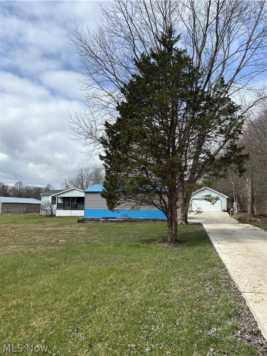 Ranch style home with 2 parcels included. Many updates - Newer roof "2023", new furnace "2023", new carport, concrete drive, laminate flooring, newer carpet, remodeled master bath with walk-in shower. Detached garage approximately 30 X 24 with concrete floor and electric. Across the street from boat club. Close to Berlin Lake.