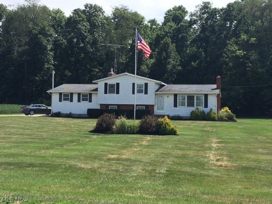 Exceptionally large split level on beautiful, private 1 acre lot. 4 car garage, one attached and 1 detached. Large 2 tier deck, great for entertaining and enjoying the large back yard. Oak kitchen and breakfast room create an open floor plan, family room with an inviting fireplace adds additional living space. Come see this well maintained and loved home!