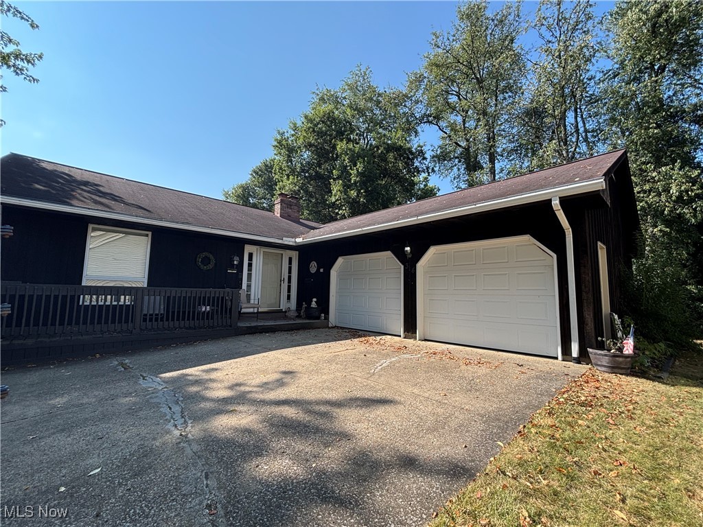 This three-bedroom ranch home offers a rare opportunity to create your dream home in a highly sought after location in Columbiana. Situated on a quiet dead end street, the property offers a peaceful and private setting. While the interior is original, the home's structure and functional layout provide a perfect canvas for modern updates. The home features beautiful wood beam ceilings in the family and dining room, along with a fireplace. The kitchen features bar seating as well as eat in dining area. The full walk out basement features the third bedroom, full bathroom, large laundry room, family room and gaming room, ideal for entertaining. After a long day at work, enjoy the large wrap around deck in the backyard. This home is a block away from the elementary school and the public library. Schedule your showing ASAP!