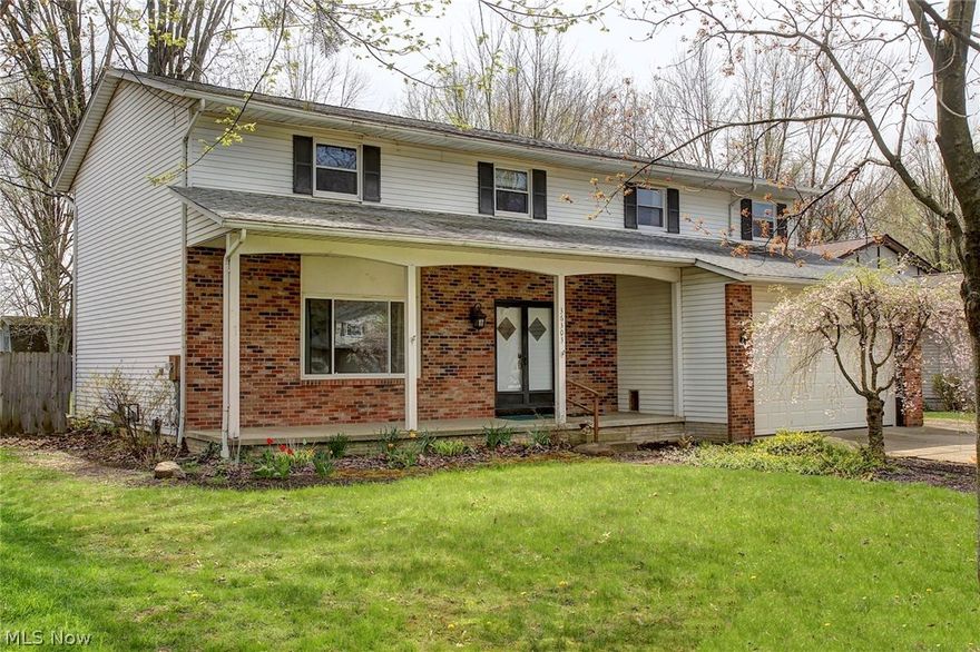 Traditional 4 bedroom, 3 full and one half bath colonial located in beautiful North Ridgeville Ohio. Quiet Street. This home features an extra full handicap bath and bedroom on the first floor. Tastefully well-built and if needed easily removed without major construction Spacious living room with gorgeous bamboo wood flooring. Formal dining room. Impressive kitchen with morning room. Family room has decorative fireplace and sliding door to rear deck, great for relaxing and entertaining. Second floor has spacious owners bedroom with massive glamour bath and walk in closet, three bedrooms and second full bath. Finish lower can add extra living space. Updates include newer flooring, new first floor suite with handicap accessible bath room, owners suite extension, deck, and professionally graded and swale installed in rear yard. Rear yard partially fenced. Now for the best part a 4 car garage at the back of lot is perfect for the hobbyist or contractor.  Conveniently located close to parks