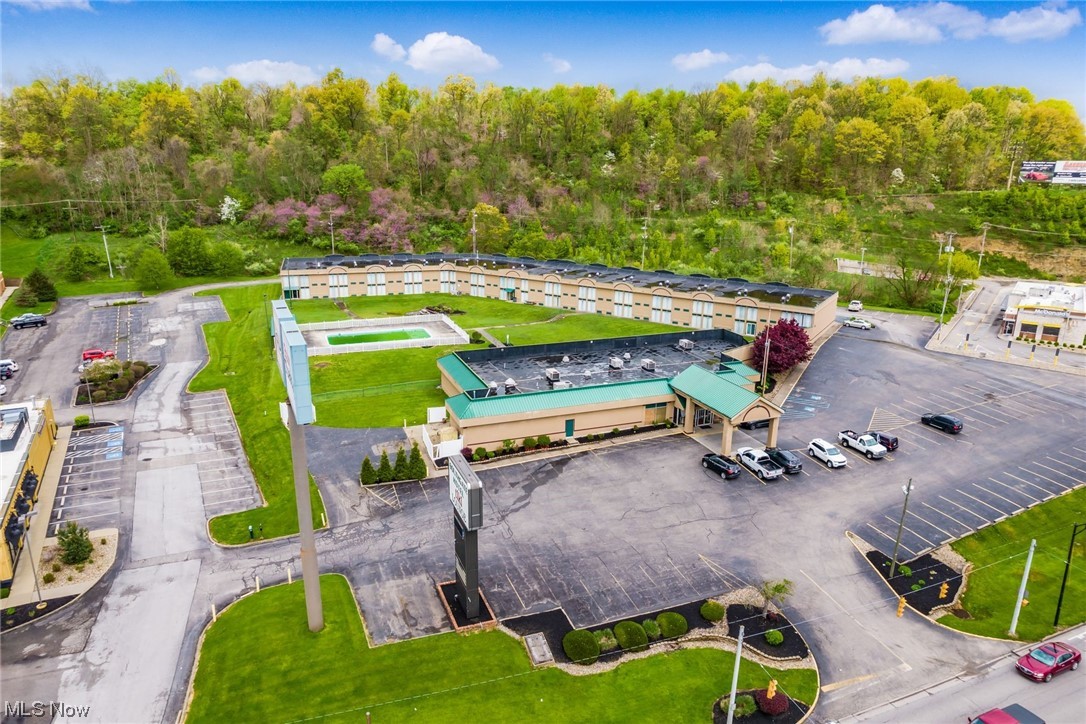 Amazing opportunity knocks. The Southgate Hotel property has been a staple in Cambridge for many years. Offering 102 rooms. A banquet hall and reception area that is utilized all summer long as there are not many venues like this around town. Did I mention the Tiki Lounge bar. Well this is a full service bar with D5A and D6 licenses with the availability to serve until 2:30am. The bar also offers a pool table and dance floor and stage area for the many attractions they have every week. Outside the bar and reception area you will find the newer covered patio with tables to relax and enjoy the views of the pool area. On site laundry service. Meeting rooms and exercise room. Vending machines with ATM. Full service restaurant style kitchen. Huge walk in coolers. A large parking lot will accommodate any kind of vehicle. With over 3.8 acres located right next to I70/I77 interchange the location of this property could not be any better. Please call with any questions as there is just so much more to list.