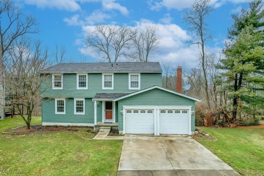 Nestled in the established Thousand Oaks neighborhood, this wonderful 4 bedroom, 2.5 bath colonial offers a welcoming blend of comfort and convenience. Tree-lined streets with sidewalks create a charming setting, just a short drive from historic downtown Medina’s shops, eateries, and events.

The heart of the home is the beautifully remodeled kitchen, featuring new countertops, cabinetry, stainless steel appliances, and a glass tile backsplash. A movable island provides casual dining space alongside the dinette, while the formal dining room with a chair rail accent is perfect for special occasions. The layout offers both a formal living room and a cozy family room with a wood-burning fireplace and patio door access to a spacious composite deck. A half bath rounds out the main level.

Upstairs, all four bedrooms are generously sized, including the primary suite with a walk-in closet and ensuite with a separate vanity area. The secondary bedrooms offer huge closets and share the hall bath. The basement has already been waterproofed with a transferable warranty and is partially finished—just add flooring to complete the space. You'll also find plenty of storage, a laundry area with a washer and dryer included, and all mechanicals, including a 50 gallon hot water tank.

Set on a gorgeous park-like lot lined with mature trees, this well maintained home also features updated windows, a newer hot water tank, roof, and furnace. Don’t miss your chance to see it!