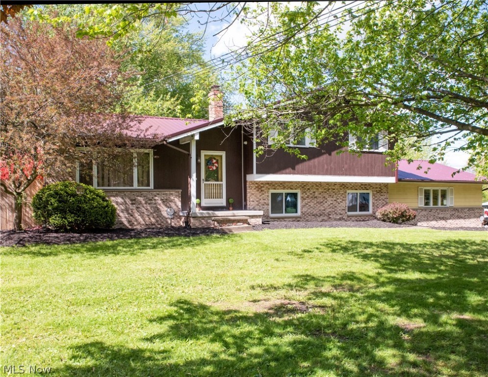 Spacious 4 level Split boasting a 12 ft vaulted ceiling on upper level, which includes a large Living and Dining Room, and Kitchen. 3 Bedrooms and the main Bath finish the upstairs. The lower level has been opened up tp a 23x25 entertainment area, with projection TV and sound system, and has walk outs to both the back yard which has a new above ground pool installed last summer, and 2 car garage. The lower 4th level has a 16x15 play, game or entertainment area. along with a separate laundry and storage area. All this on a half acre lot.
