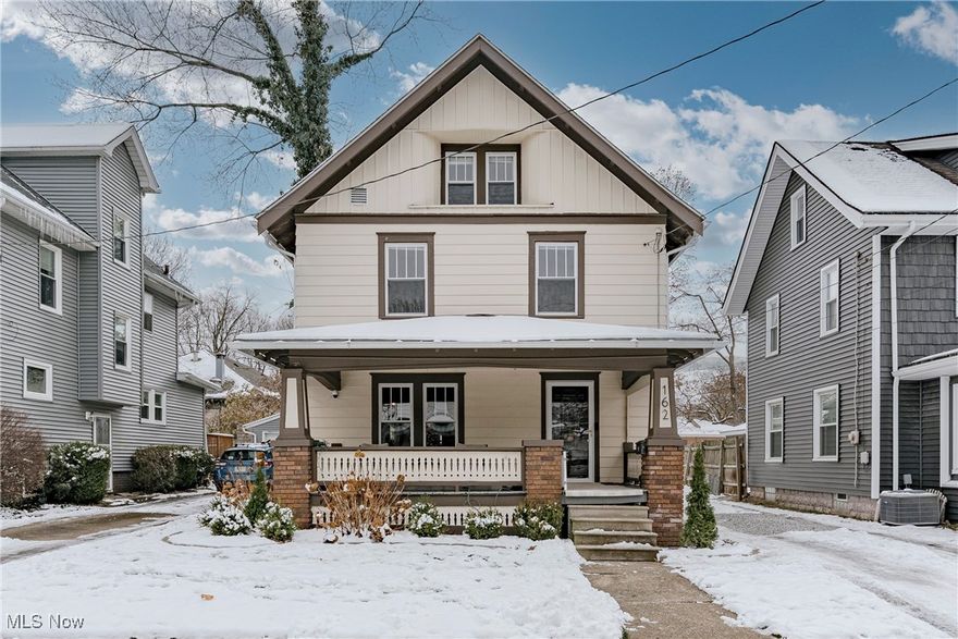 Welcome to 162 Portage Dr - This beautifully maintained home perfectly blends original 1920s character with the modern updates today’s buyers love. Nestled in one of Akron’s most popular and walkable neighborhoods, this inviting colonial offers timeless style, flexible living spaces, and a backyard designed for relaxation and gardening. Step onto the welcoming front porch and into a charming foyer that sets the tone for the entire home. The foyer flows into a bright and cozy living room featuring gleaming wood flooring, a classic brick fireplace and two stunning stained-glass windows that add warmth and personality. French doors lead gracefully into the formal dining room, where a coffered ceiling and beautiful leaded-glass built-ins create an elegant space for gatherings and celebrations. The adjacent updated kitchen features stainless steel appliances, butcher-block counters, subway-tile backsplash, and direct access to the backyard—perfect for easy indoor-outdoor living. A convenient half bath off the foyer completes the first floor. Upstairs, the second floor offers three comfortable bedrooms and an updated full bath that combines old-world charm with modern convenience, including the original clawfoot tub and a separate step-in shower. The upper floor serves as a private retreat with a spacious fourth bedroom currently used as the primary suite, complete with a walk-in closet and a thoughtfully designed ensuite bath. The full lower level provides plenty of storage space, along with a dedicated laundry area. Outside, the large backyard is ideal for families and gardeners alike, featuring raised beds, a storage shed, a cozy back porch, and partial fencing for privacy. All of this in a highly desirable location—just moments from Highland Square’s popular shops, restaurants, parks, and community events. This home brings together charm, convenience, and modern comfort in a truly special way.