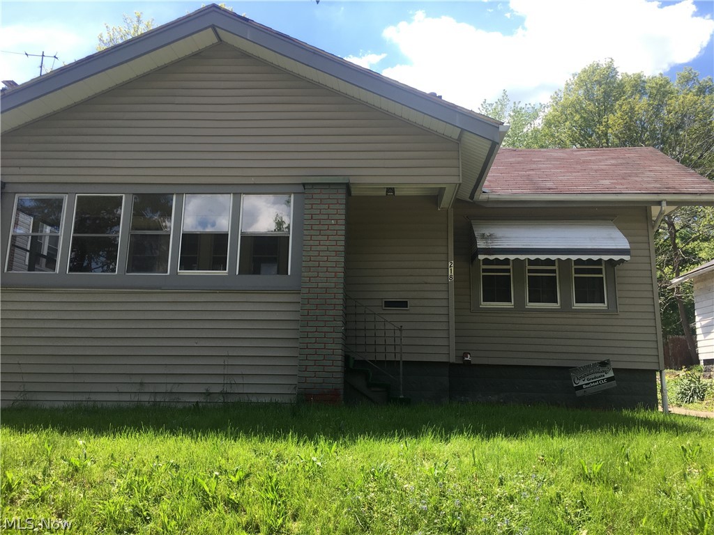 Currently an investment property. Lease ends in August. Cute bungalow . There is three season room in the front of home that enters into the large living room with a wood burning fireplace. (The fireplace was inspected about two years ago for use). between living room and kitchen there is a small dining area with builit ins. There are two first floor bedrooms in the back of the house. One bedroom has an exterior door with a wood ramp entering the home. The third bedroom is on the second story. There is a full size basement with one finished room that can be a play room, office, work out room, etc. Please allow 24 hours notice to schedule showings.