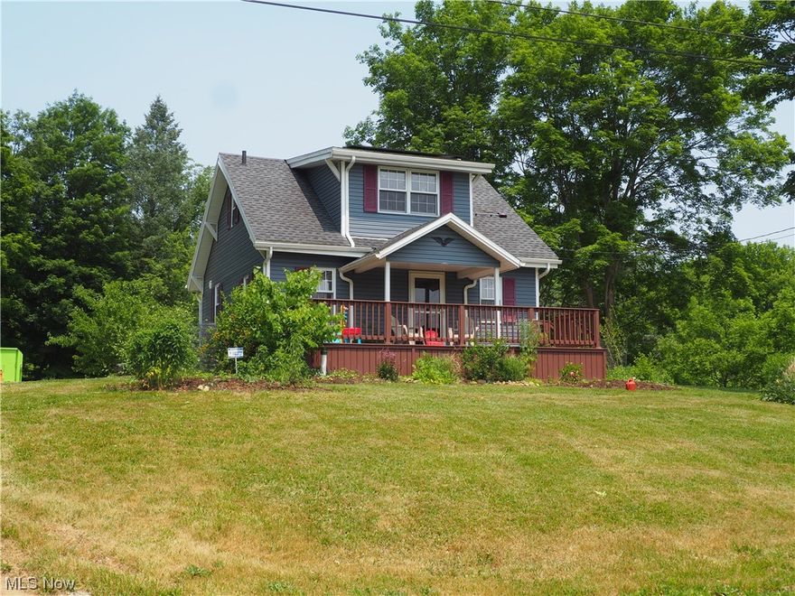 Mini Farm or park waiting for you to enjoy almost 1 acre of land rich with apple and chestnut trees, bush cherries, blue berries & hazel nuts plus herbs and other edible plants.  Still room for your garden plus an established garden area.  Cozy 10 X 24 front porch for relaxing after a busy day. Updated 2-bedroom 1½ bath home with newer applianced kitchen and newer hickory floors in kitchen, living and dining rooms. Beautiful updated main bath with step in shower plus cast iron bathtub. First floor laundry with washer and dryer that stays.  Two car garage plus large, attached workshop for that handyperson who likes to tinker.  Refrigerator-2019, stove-2019, washer-2023, dryer-2019 and water softener-2020.  Furnace and hot water tank- 2019.  Most plumbing replaced 2019 plus a new septic system installed 2019. Solar panels on House and garage installed 2022 help to lower utility bills plus keep most utilities humming in case of a power failure. New retaining wall in back plus extra parkin