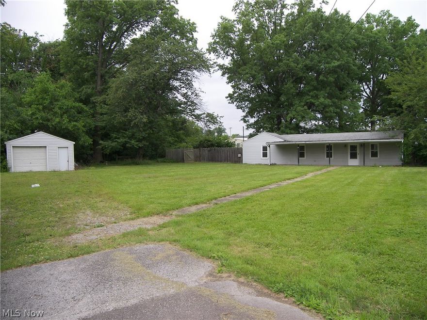 Home needs extensive work.....totally gutted inside.... and has city water and sewers.  Would make a great rehab ....partially fenced yard....possibilities are endless