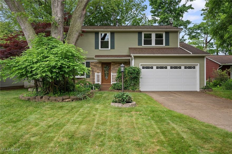 Located on a tree-lined cul-de-sac street just minutes from Lake Erie, this spacious Colonial sits on over .21 of an acre property, featuring a front porch, enclosed patio, and low-maintenance composite Trex deck. This move-in ready home has 4 bedrooms, 2.5 baths, and over 2,454 living sq ft including a partially finished basement. A light-filled living room with bay window leads into a flexible dining room that the current owners use as an office. An eat-in kitchen has quartz countertops, and a family room with stone surround gas fireplace offers access to the enclosed patio, deck, and spacious back yard with wooded views and a shed. The owners' suite features a walk-in closet and an updated en-suite bath with two vanities and a walk-in shower. Recent updates include: Replaced furnace and A/C (2016), roof (2013), windows (2017), vinyl siding (2017), replaced deck boards with Trex composite decking (2022), installed Trex front porch with railing (2022), installed sealed gas fireplace insert (2023), updated master bath and shower, built closet organizer in master walk-in closet, installed ceramic tile flooring and replaced tub with jetted tub and tile in main bath, installed ceramic tile flooring in kitchen and hallway, installed LVP flooring in living room and office, installed wood-look ceramic tile in family room and throughout 2nd floor, installed sliding barn doors in office/kitchen and family room, freshly painted throughout, and more! INCLUDED are all kitchen appliances except fridge, window treatments and rods, and furniture in the enclosed patio. Conveniently located near OH-2, Mentor Lagoons Marina, shopping, restaurants, parks, and other local attractions. Point of Sale inspection completed and violation free.